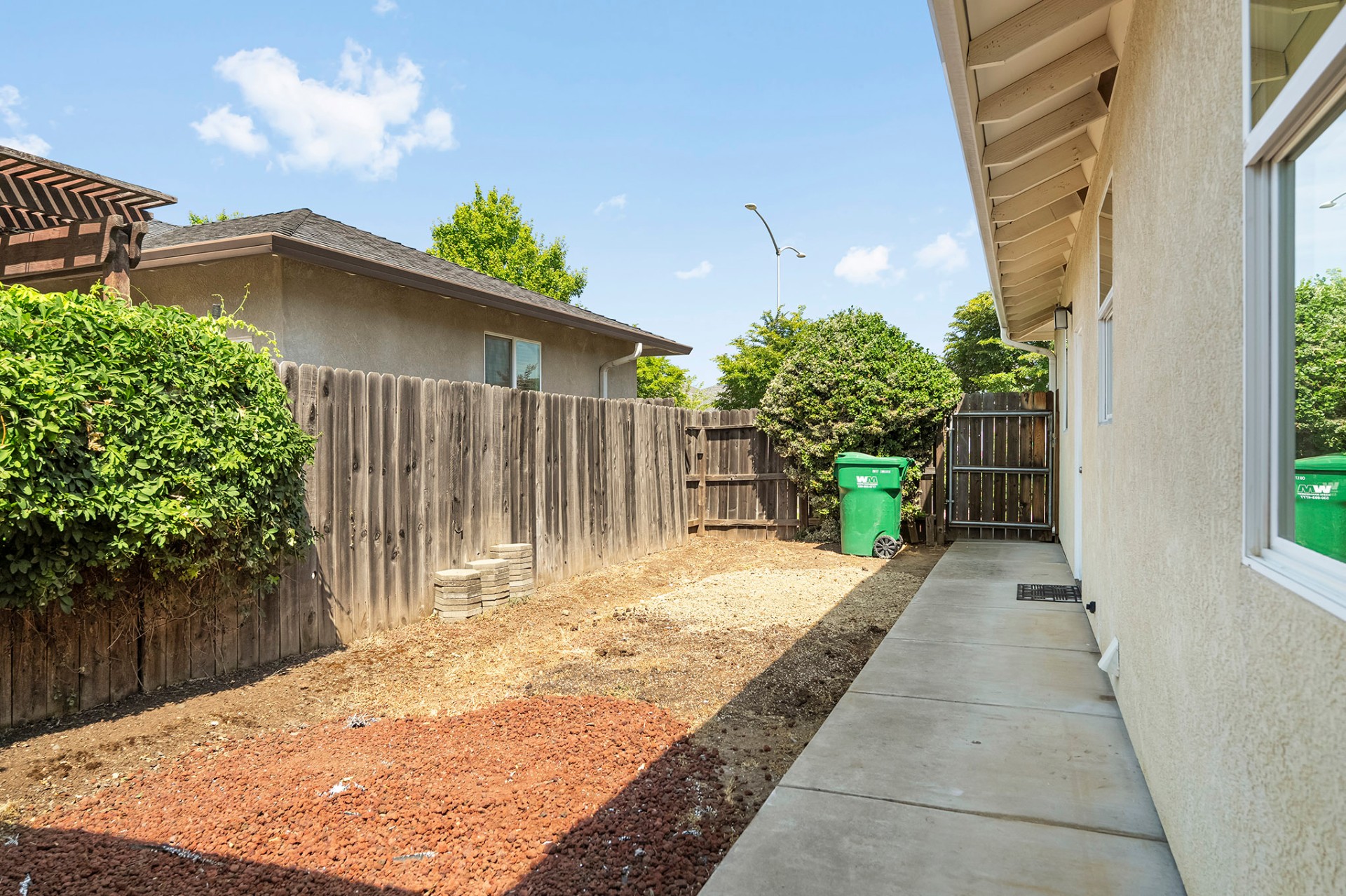 Side yard with gated access and walkway