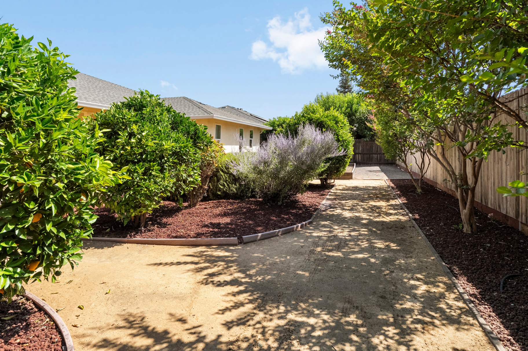 Long garden walkway alongside the home
